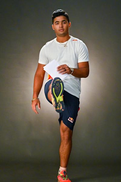 Indian cricket all-rounder Riyan Parag performs warm-up exercises to be done before a cricket match