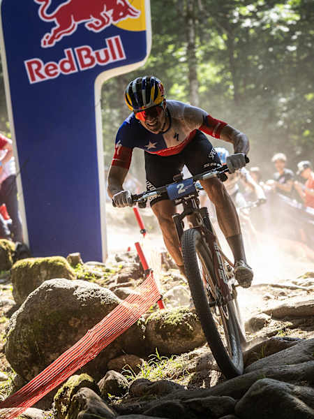 On June 20, 2025, Martín Vidaurre Kossmann rides through a challenging rocky section at the UCI Mountain Bike World Cup in Val di Sole, Italy.