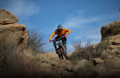 Eliot Jackson navigates a rocky mountain bike trail.