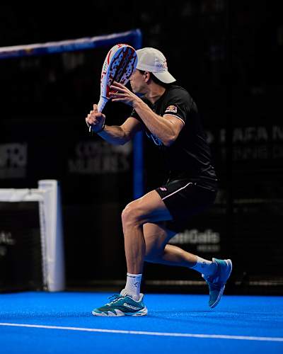 Red Bull athlete Juan Lebrón Chincoa in action at the Cancun Premier Padel P2 quarter-finals in Mexico on March 14, 2025, bringing unmatched energy to the vibrant blue court