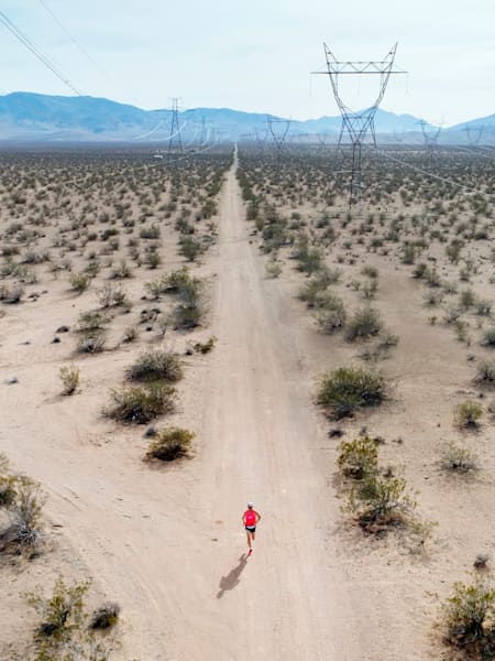 A runner competing in The Speed Project in the desert. 
