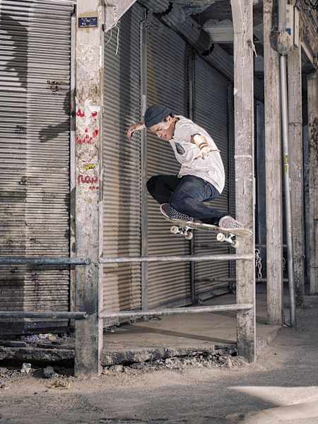 Jaakko Ojanen snaps a tweaked-out Switch Ollie over a flat bar in Tehran's old bazaar