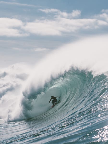 A photograph of surfer Justine Dupont shot by Rick Guest for The Reed Bulletin.