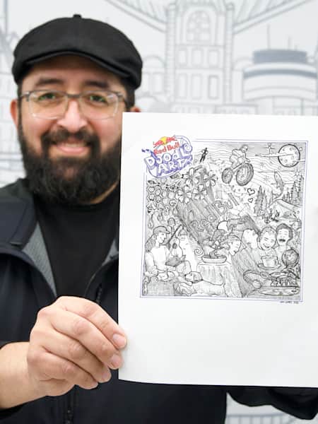 Juan Gomez, winner of Red Bull Doodle Art Canada, holds up his doodle