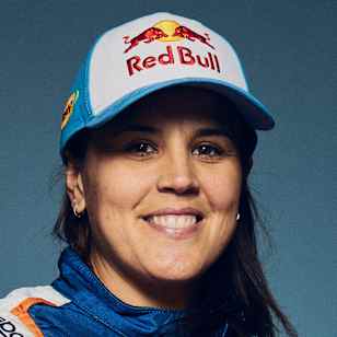 Laia Sanz, Red Bull athlete, poses in racing gear in 2024.