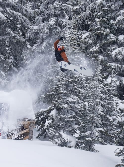 Ben Ferguson performs a grab during his qualifying run at Natural Selection Tour 2025 in Revelstoke, Canada.