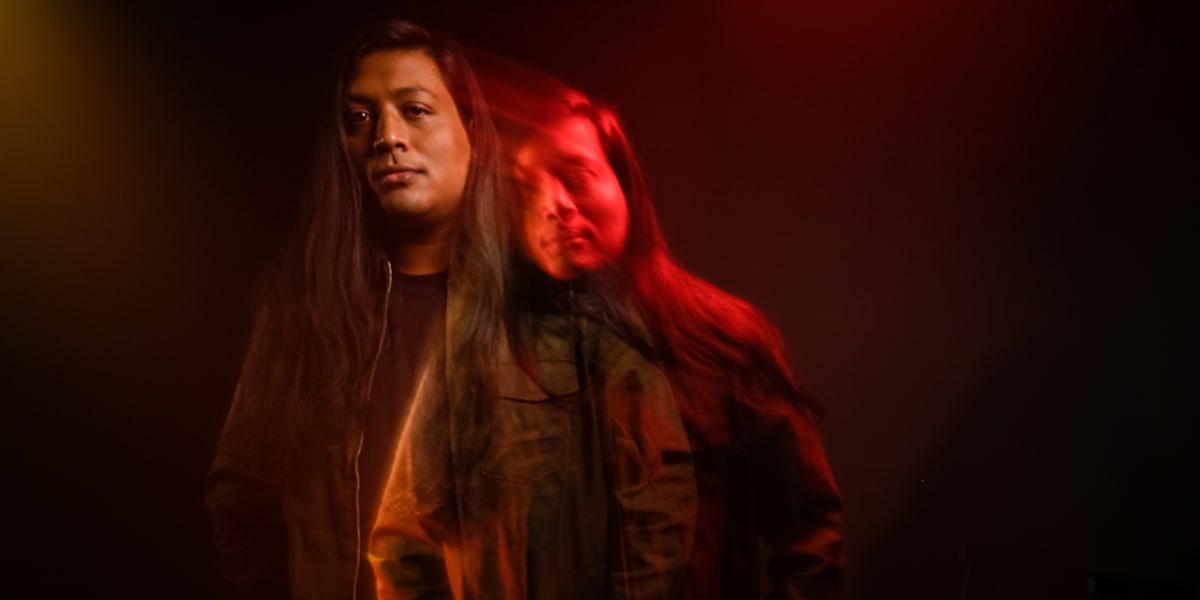 Karan Kanchan in a red-and-yellow double-exposure portrait