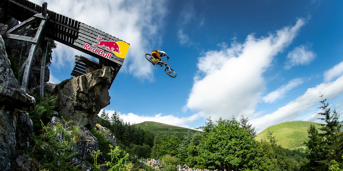 A rider launches from the giant jump above the crowd at Red Bull Hardline Wales.