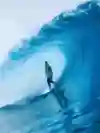 Surfer Michel Bourez rides the tube at Teahupo'o in Tahiti.