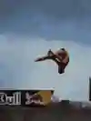 Cliff diver Jonathan Paredes is seen diving from a Red Bull board.