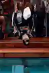 Mark Webber backflips into the pool in Monaco