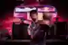 Brazilian Leage Of Legends player TinOwns won the 2016 Red Bull Player One tournament and celebrates with the trophy