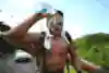 Ross Edgley pouring water on his face during a trathlon in Nevis