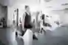 A woman doing weighted squats in the gym