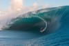 Carlos Nogales rides into an XXL wave in Tahiti