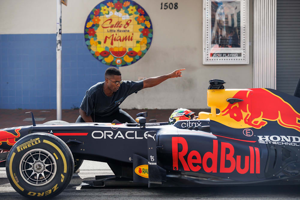 Miami Dolphins player Byron Jones gives directions to the Miami GP track