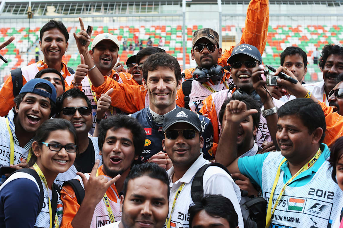 Mark Webber of Red Bull Racing with fans at the 2012 Indian Grand Prix
