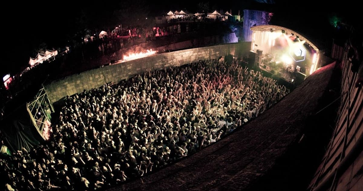 Crowd inside the fortress walls at Dimensions Festival