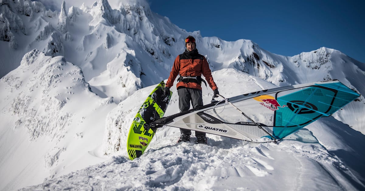 Levi Siver Windsurfer rides down a snowy mountain