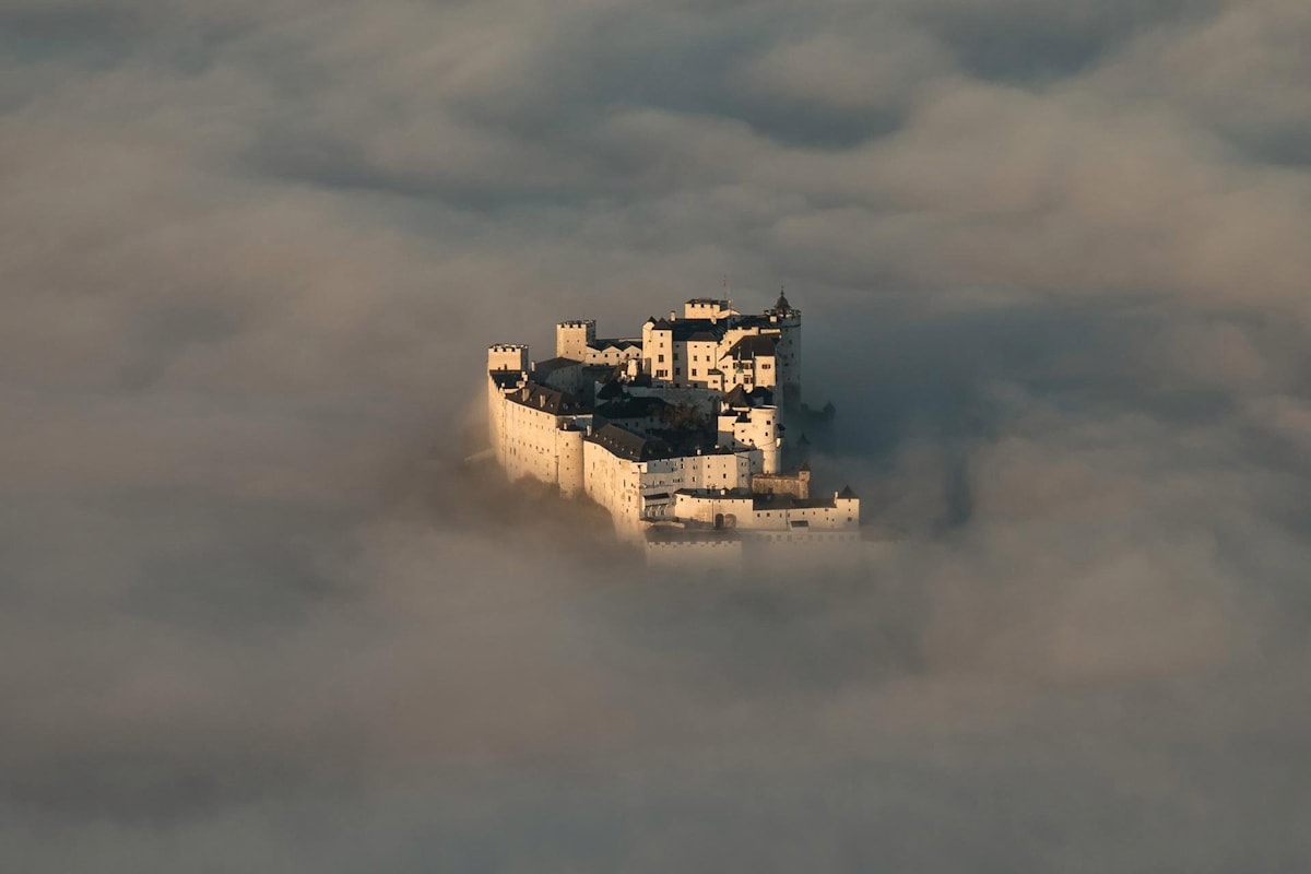 The Festung Hohensalzburg sits above the clouds in Austria