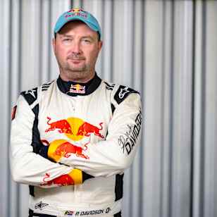 Red Bull athlete Patrick Davidson stands confidently in his racing suit at Red Bull Can Grab, Gqeberha, South Africa, 2025, representing the spirit of adventure and speed