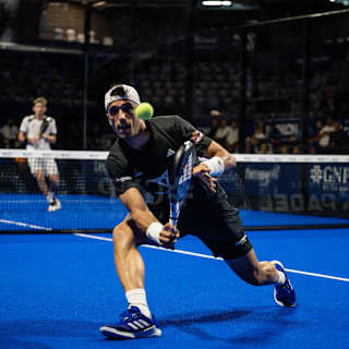 Alejandro Galan lunging towards a shot at the ball at the Premier Padel Acapulco P1, 2024