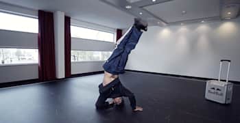 Crazy Legs from Rock Steady Crew does a headstand.