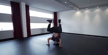 B-Boy Neguin is pictured doing a handstand in Break Advice: Fundamentals.