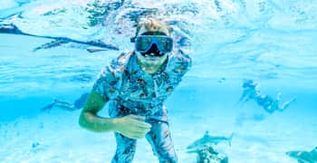 Jamie O'Brien wears a scuba mask underwater.