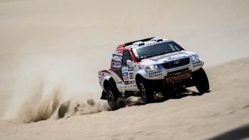 Giniel De Villers tests his Toyota Hilux over the sands of Peru on the second stage of the 2013 Dakar Rally