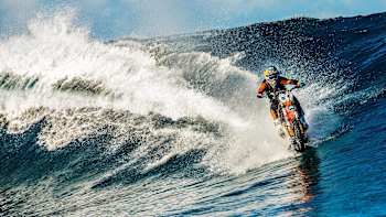 Motocross rider Robbie Maddison riding the waves in Tahiti.