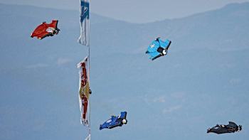 Wingsuit pilots pass a Red Bull Aces gate in 2015