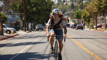 Nico Deportago-Cabrera riding his bike in a Red Bull helmet on the way to Onion Valley, California.