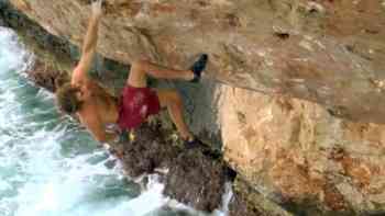 Chris Sharma climbs at the Mediterranean Sea