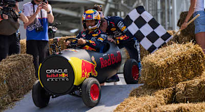 Max helping Checo with a rolling start