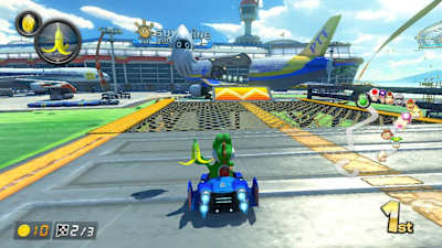 A screenshot of Yoshi with a banana in Mario Kart 8 Deluxe