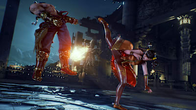 Well ain't that a kick in the head. A Tekken character delivers a huge kick on an opponent.