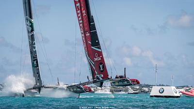 ETNZ 'cycle' past Land Rover Bar during race 11