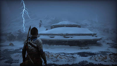 Atreus looks upon the frozen Lake of the Nine with a Thor lightening strike in view in God of War Ragnarok