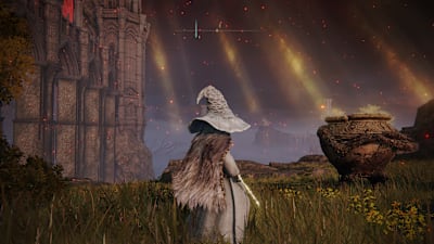 A snow witch stands before a cracked jar in a field in Elden Ring
