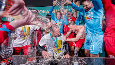 Marco Rose grabs a shower at the press conference