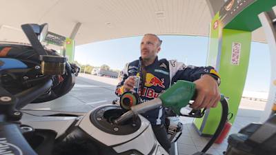 Sam Sunderland refuels his motorcycle at a Serbian petrol station during the European leg of his Around the World record attempt.