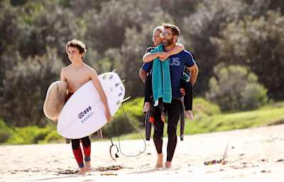 Sam and family head for the surf.