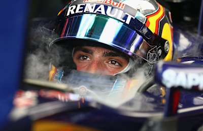 Carlos Sainz of Spain and Scuderia Toro Rosso sits in his car in the garage at the Malaysian Grand Prix.