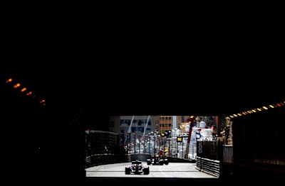 摩纳哥隧道 Sebastian Vettel of Germany leads his team mate Mark Webber of Australia and Infiniti Red Bull Racing during the Formula One Grand Prix of Monaco