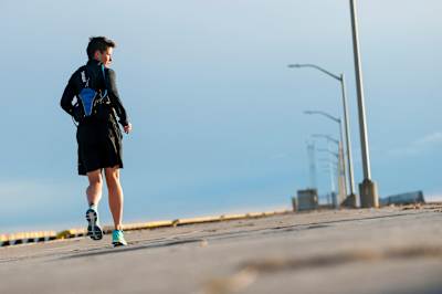 Kat Clewley running backwards as she trains for a marathon