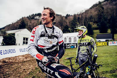 Rémi Thirion and Claudio Caluori look at their times following a run down the Lourdes DH course