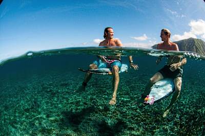 Jordy Smith and Kolohe Andino floating over the Tahitian reef
