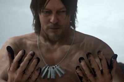 A man looks at his hands in Death Stranding