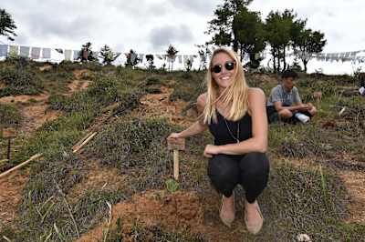 As part of her mission for sustainable tourism, Cassie De Pecol planted many trees in different countries during her journey.